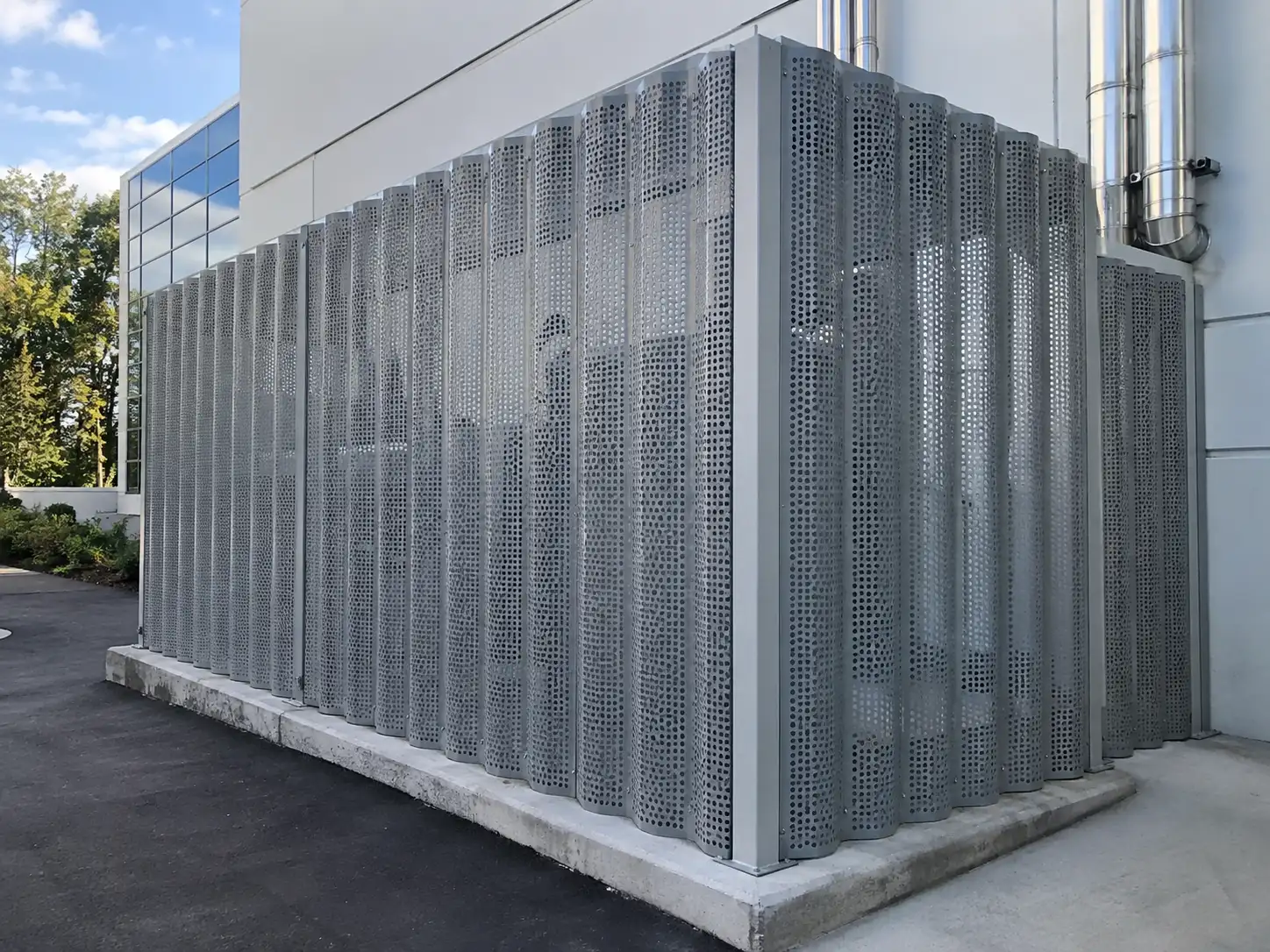 Better Ventilation Corrugated Perforated Metal Corrugated perforated metal screen enclosure providing ventilation and equipment protection in an outdoor installation