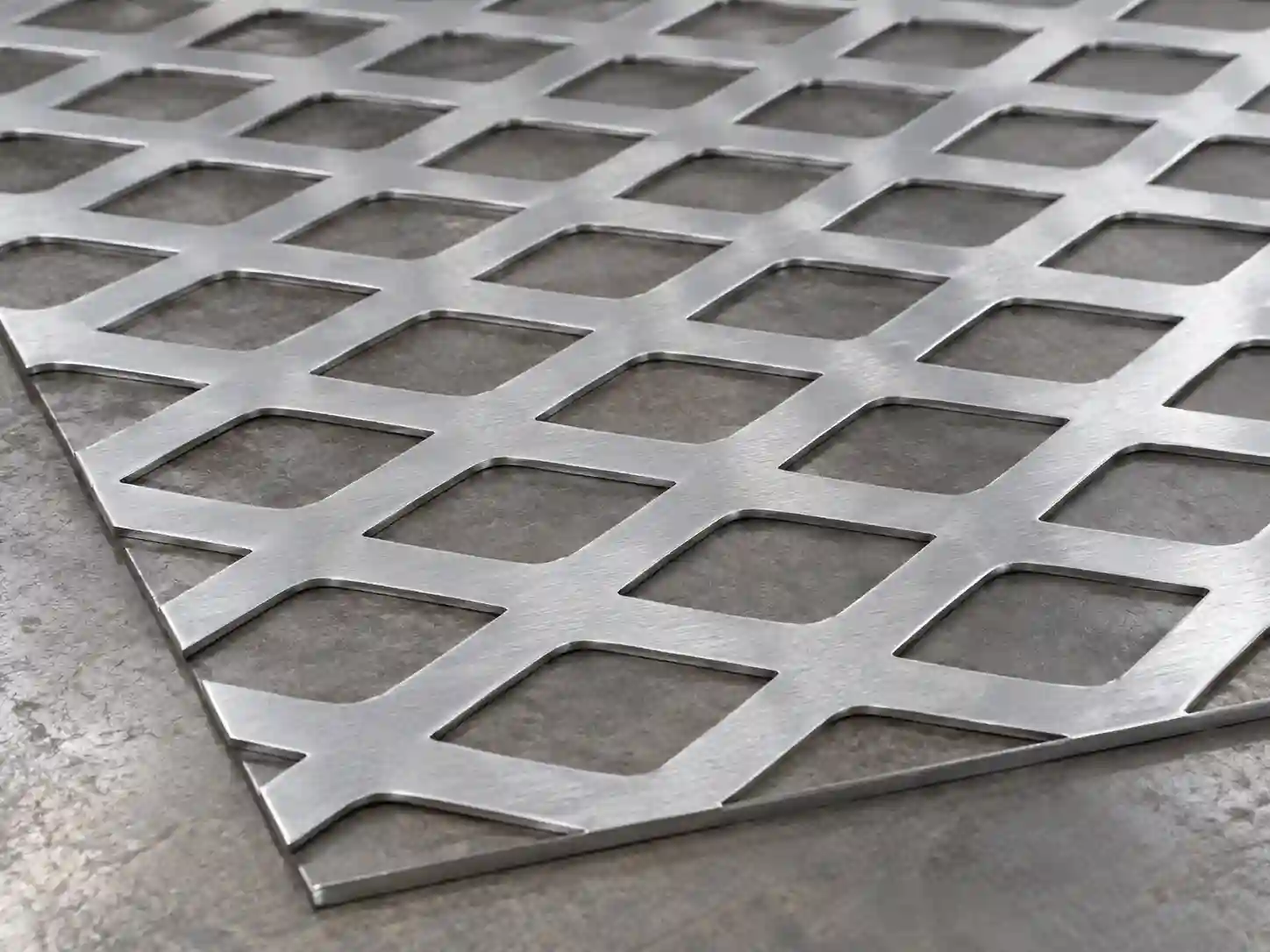 Flattened Stainless Steel Expanded Metal Flattened stainless steel expanded metal sheet with a smooth diamond mesh surface