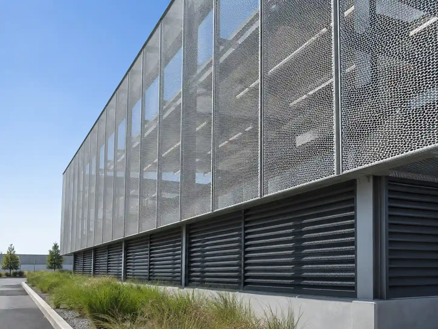 Perforated metal screening panels installed on a modern building facade for ventilation and sun shading