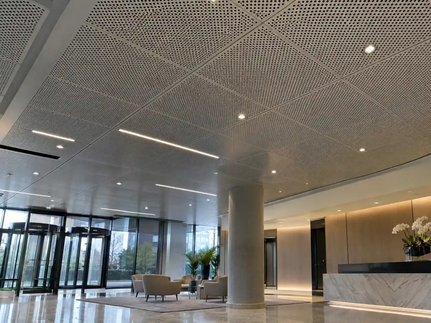 Perforated Metal Ceiling Panels Perforated metal ceiling panels installed in a modern commercial lobby for ventilation and acoustic performance