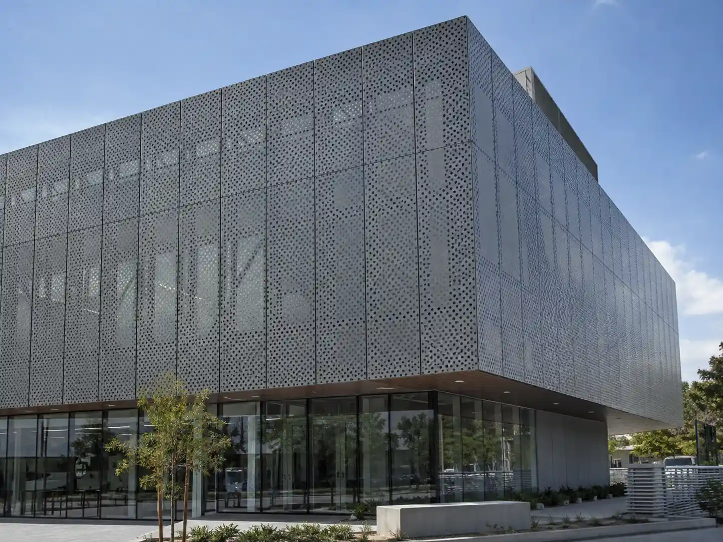 Perforated Metal Facade Panels Custom perforated metal facade panels used as exterior cladding on a contemporary commercial building