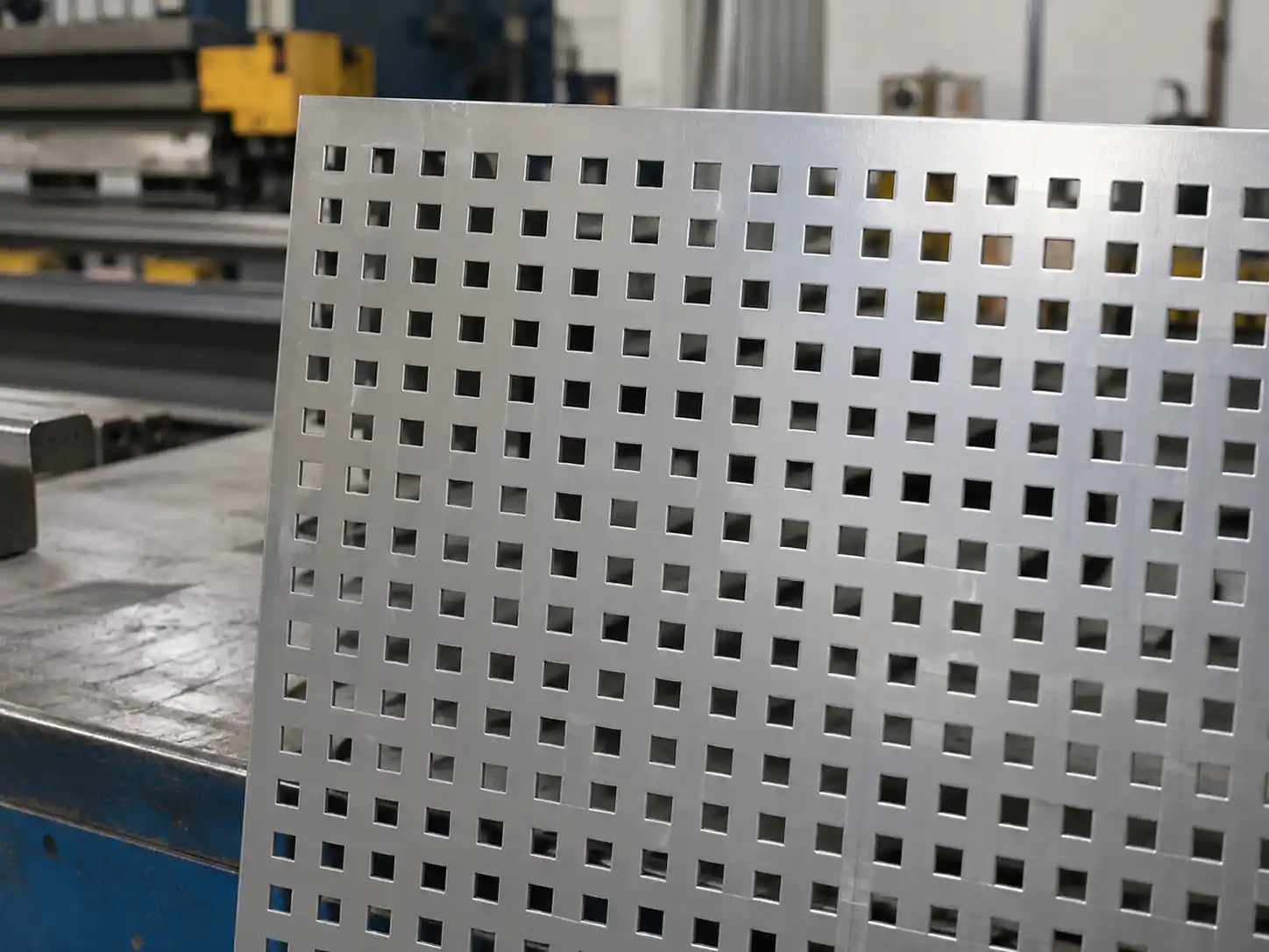 Square Perforated Metal Square perforated metal sheet with evenly spaced square holes in a straight geometric pattern