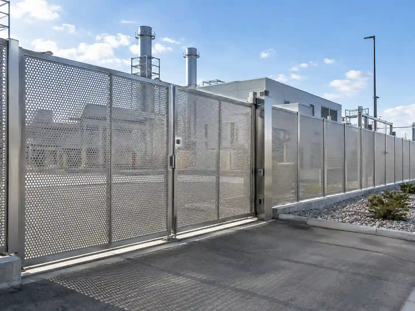 Stainless steel perforated metal fence and gate used for industrial perimeter security